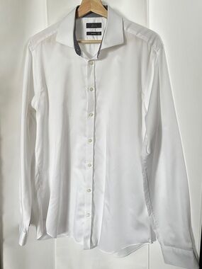Fits perfectly with blue/brown windowpane suit. 100% Cotton. White dress shirt.
